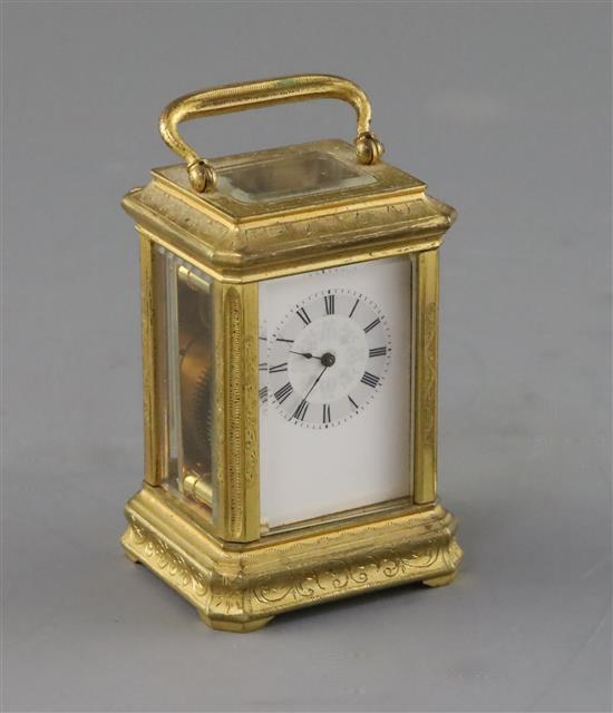 A late 19th century French miniature ormolu carriage timepiece, 3in., with original travelling case